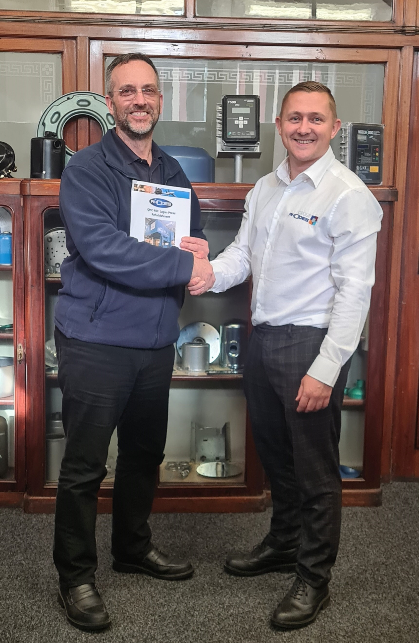 Senior engineer at Rhodes Interform Ben Jennings (right) with Braime Pressings’ Operations Director Alistair Barr after signing the contract to refurbish the press.