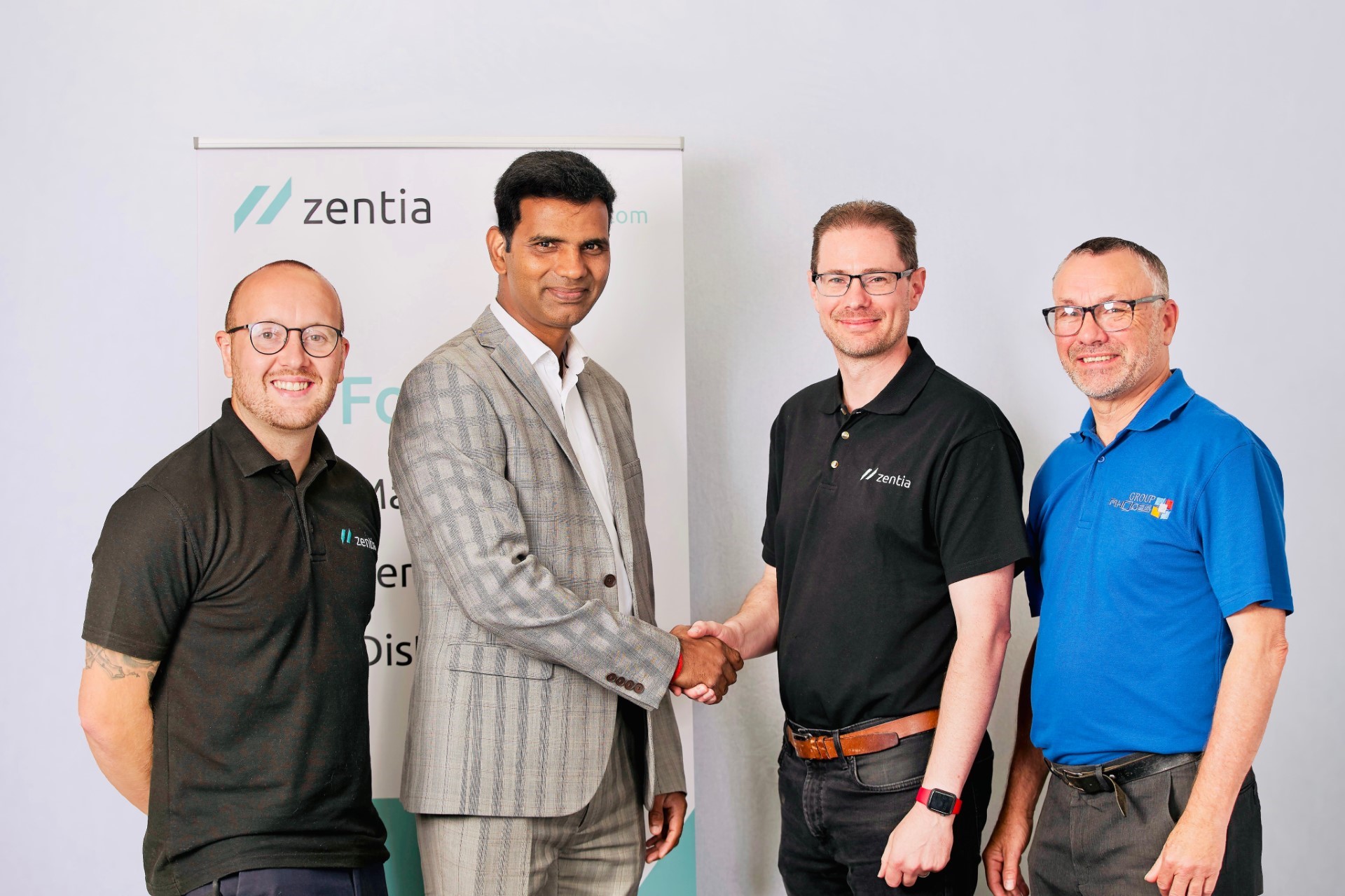 Group Rhodes’ Commercial Director Raghunath Chandrasekaran (shaking hands on the deal) with Neil Hunter , Engineering, and Improvement Manager at Zentia, with Geoff Barker from Rhodes Interform (far right) and Lewis Cameron, Zentia’s Procurement Commodity Manager (far left).